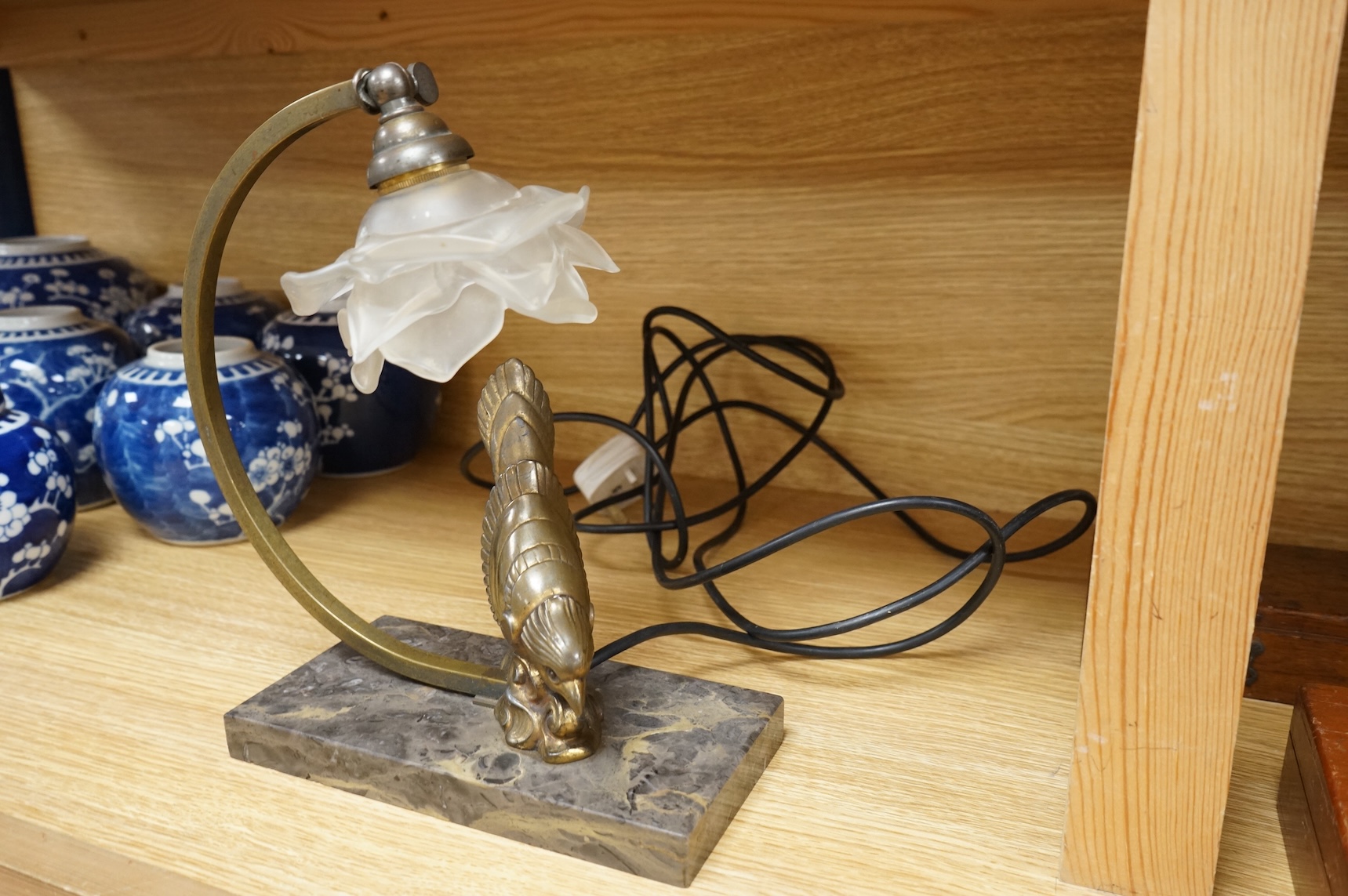 An Art Deco table lamp in the form of a bird with tchecoslovaquie glass shade, 26cm high